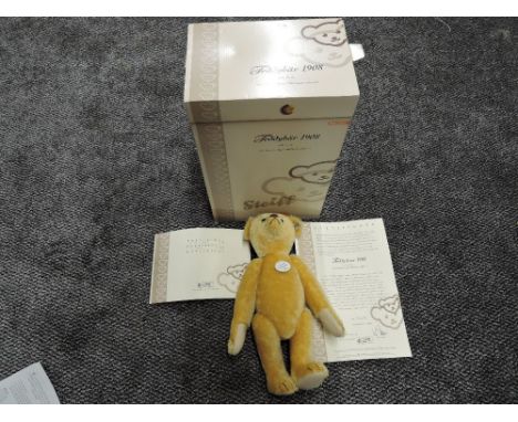 A modern limited edition Steiff Teddybear 1908 replica, height 35cm having white tag 406751, with certificate 02178/3000 and 