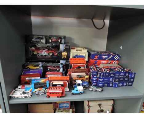 A shelf of 1980's and later diecasts including Corgi in blue and red boxes, Days Gone, Exchange and Mart, Classico etc, most 