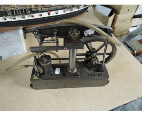 A Stuart Turner Live Steam Beam Engine on cast metal base, diameter of flywheel 17.5cm, height of engine 27cm, length of beam