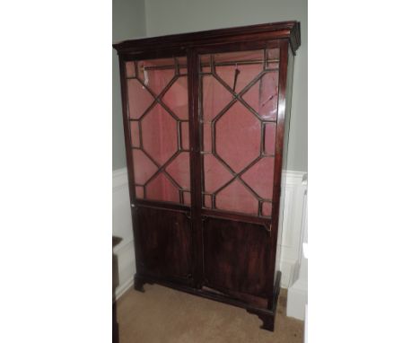 A 19th Century mahogany Chippendale style two-door Wardrobe, each door with glazed upper panels. (1)