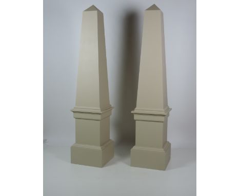 A very fine pair of hand crafted wooden Obelisks in the antique style, painted in a Georgian light green colour, on square mo