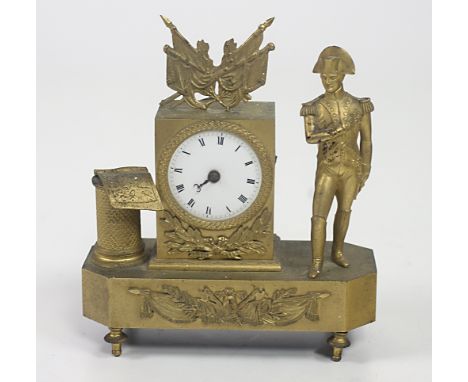 A small 19th Century gilt metal Mantle Clock, French 2nd Empire, pedestal surmounted with flags and with circular enamel dial