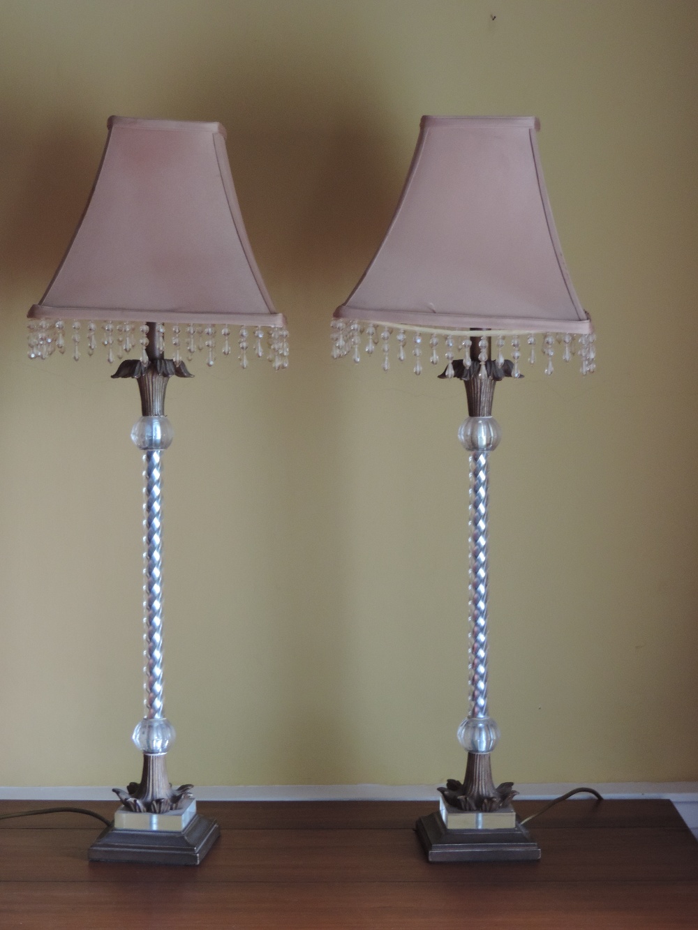 An attractive pair of tall Bedside Lamps, each with glass barley twist