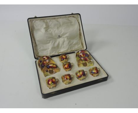 A fine Edwardian Royal Worcester Co. hand painted Coffee Set, 6 cups and saucers, each cup with gilt interiors, and all decor