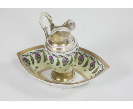 A 19th Century English porcelain oval shaped Basin & Ewer, the yellow ground body decorated with flowers and gilt, and a whit