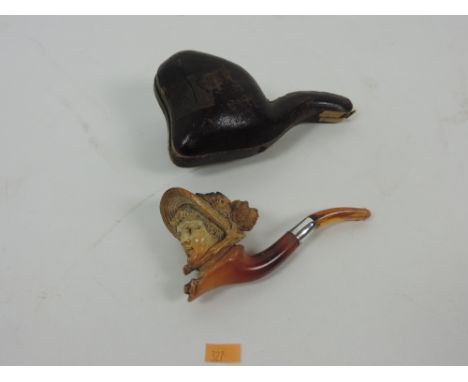 A good quality 19th Century meerschaum Pipe, carved with the head of an elegant lady with bonnet, with silver mount and in or