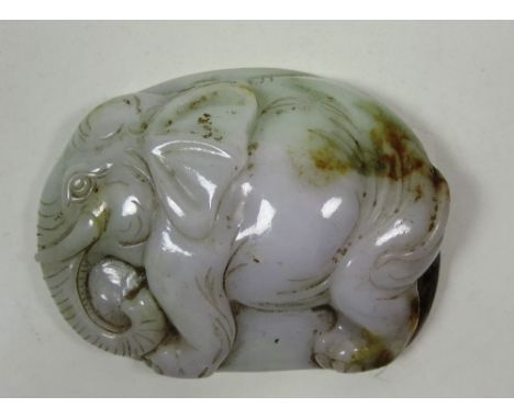 A rare and unusual grey / green jade Paperweight?, carved in the shape of an elephant, approx. 8.5cms (3 1/2") long. (1)