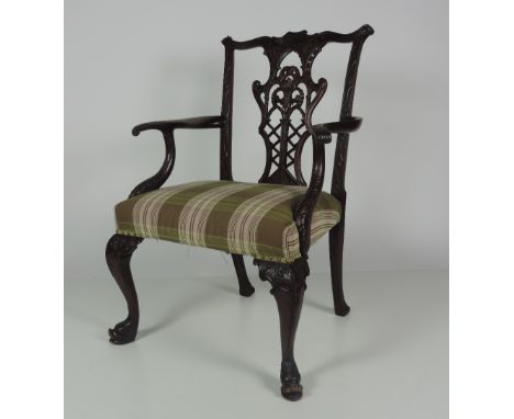 A very good early 19th Century large carved mahogany Armchair, in the Chinese Chippendale style, the shaped pierced and carve
