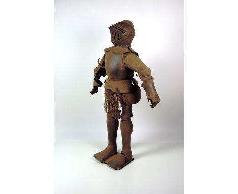 A Victorian Suit of Armour, in the 16th Century style, the late Victorian suit comprising of helmet, breast plate, tassets, b