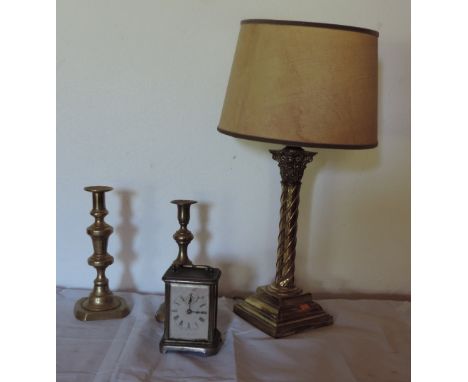 Two similar brass Candlesticks, and a plated brass Carriage style Clock. (4)