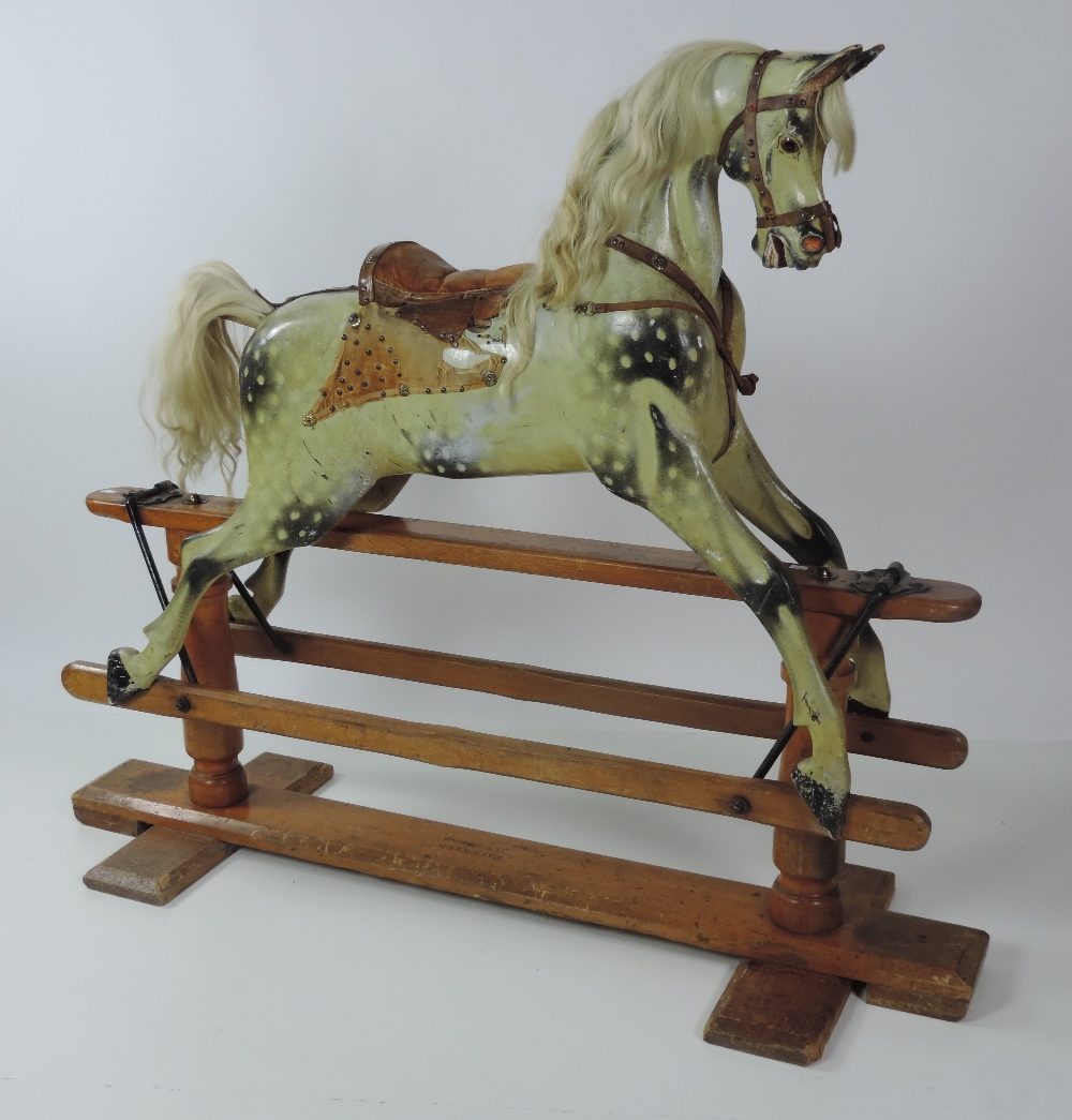 A fine large Victorian carved and painted wooden Rocking Horse, with