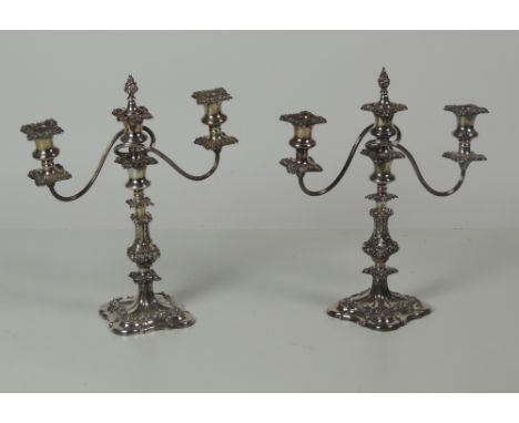 A good pair of early 19th Century silver plated on copper two branch three light Candelabra, each with centre stoppers, appro