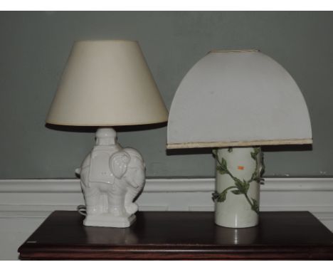 A white porcelain Table Lamp, in the shape of an elephant, and another porcelain Lamp with green encrusted branches, and a la