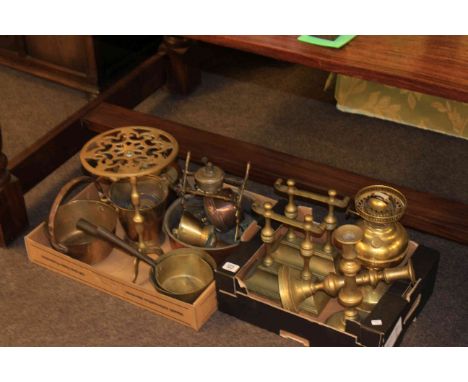Two boxes of brassware including candlesticks, trivet, pans, oil lamp, andirons, etc