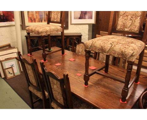 Webber furniture rectangular oak dining table, six tapestry panel back dining chairs and oak four door bookcase