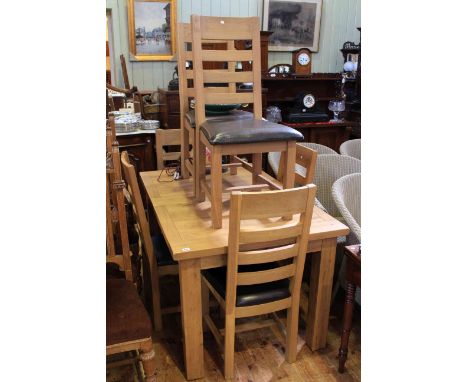 Morris Furniture light oak extending dining table and six bar back dining chairs