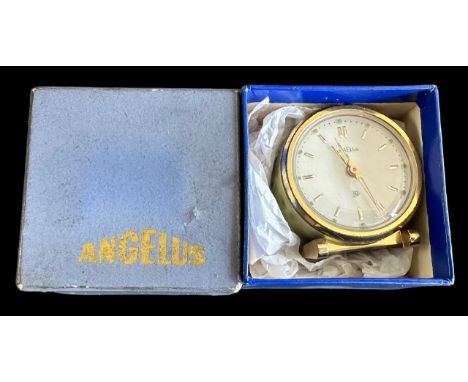 Angelus 8 Day brass Travel /Alarm clock, round form with marbled finish. Marked to base 1045. Wind to reverse, in original An