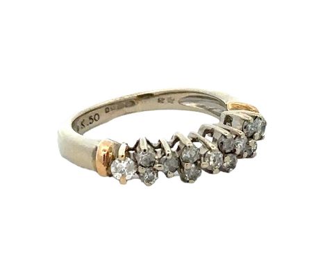 A diamond ring with 13 diamonds set in 9ct gold, size K. London hallmarks. Diamond weight approx 0.46ct. Weight 3.18g.Please 