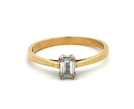 An 18ct yellow gold and emerald cut diamond single stone ring. Diamond approx 4.3mm x 3mm, 0.25ct. Weight 2.03g. Diamond in g