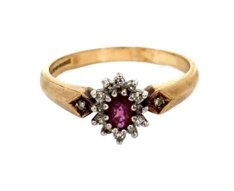 A ruby and diamond cluster ring with diamond accents in the shoulders, size Q. Hallmarked 9ct yellow gold. Ruby approx 5mm x 