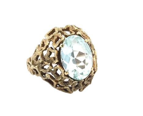 An aquamarine ring with a textured effect setting, stamped 585, size P. Aquamarine approx 14mm x 10mm. Weight 9.58g. Please s