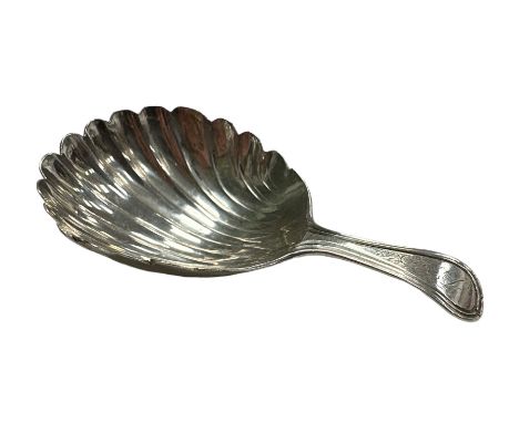 George III Silver caddy spoon, shell shaped bowl with curved handle with worn initials engraved to handle. Length 7cm, weight