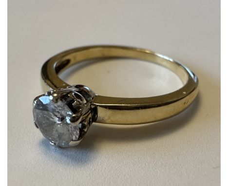 A diamond solitaire ring of approx 0.6ct. Clarity I2. Weight 2.88g. Unmarked gold but tests as 18ct. Please see the buyer's t