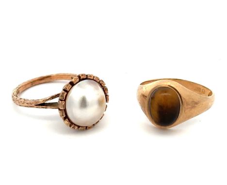 Two 9ct gold rings. One set with a tiger's eye cabochon, size P - shank misshapen with some nicks and dents, tiger's eye with