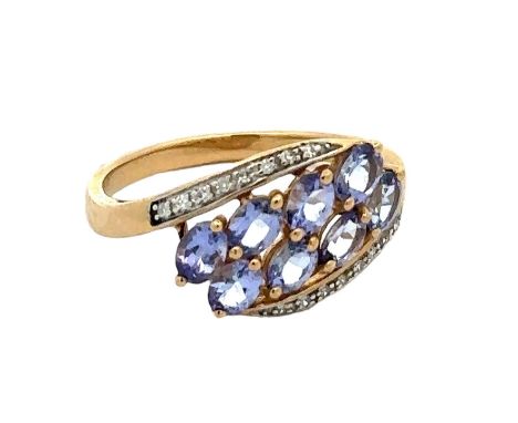 A hallmarked 9ct gold, tanzanite and diamond ring, size P. Weight 2.52g. Good condition overall. Stones all present, secure a