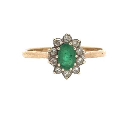 A 9ct gold emerald and diamond cluster ring, size Q. Oval emerald 6mm x 4mm. Ring weight 1.62g. Please see the buyer's terms 