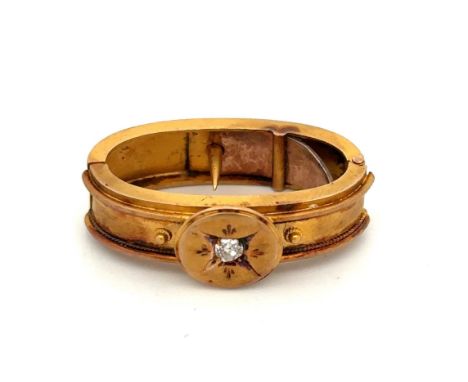 A bloomed gold scarf clip with central old cut diamond, approx 3mm in diameter. Weight 5.12g.Please see the buyer's terms and