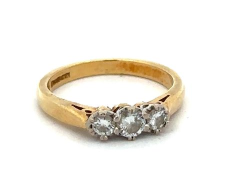 A hallmarked yellow 18ct gold and three stone diamond ring, size I. Diamond weight approx 0.3ct. Weight 2.72g. Please see the