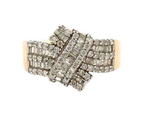 A hallmarked 9ct gold and diamond dress ring set with round and baguette cut diamonds, size O, Weight 6.52g. All stones prese