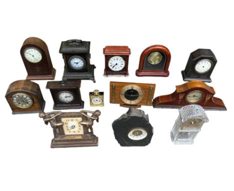 A collection of 16 various clocks plus parts, with one by the Colonial Clock Co., one by Europa, a miniature brass lantern cl