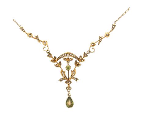 An Edwardian peridot and seed pearl pendant necklace stamped 14K on chain stamped 9ct. Overall length 44cm. Weight 4.56g. Ple