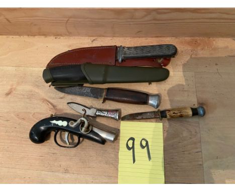 A collection of knives and pistol lighter 