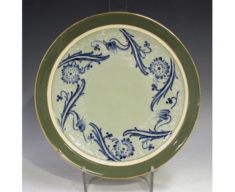 A James MacIntyre &amp; Co Ltd Gesso Faience Florian Ware plate, circa 1900, decorated with flowers and scrolls, brown printe