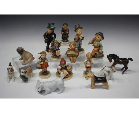 Five Royal Copenhagen models of dogs, including Dog with Slipper, No. 145, Seated Pug Puppy, No. 3169, and Standing Terrier, 