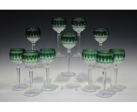 A set of sixteen Waterford Crystal Clarendon emerald hock glasses, together with a pair of ruby flash overlay glass vases of 