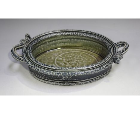 A Walter Keeler studio pottery two-handled oval dish, covered in a blue/green salt glaze, impressed mark to side of dish, len