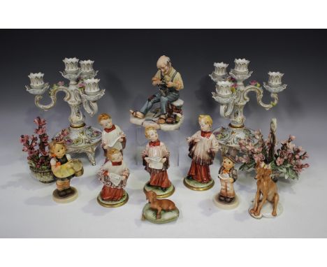 A small group of Capodimonte, including a set of four figures of choir singers, height of tallest 16cm, and two baskets of fl