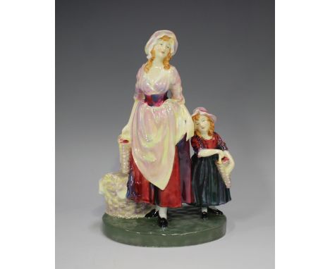 A Royal Doulton figure of London Cry, HN749, designed by L. Harradine, height 17.5cm.Buyer’s Premium 29.4% (including VAT @ 2