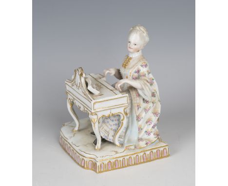 A Meissen figure emblematic of the sense Hearing, 19th century, modelled after Schönheit as a lady seated at a piano, the sha