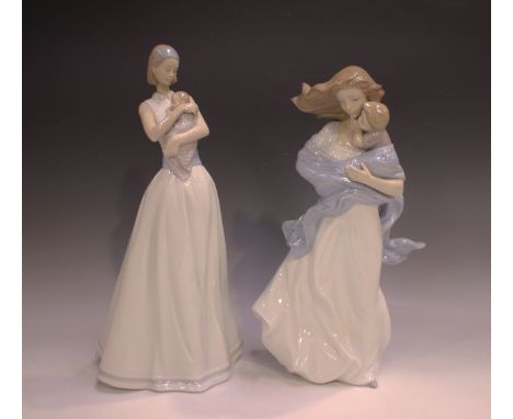 A Lladro porcelain figure group Loving Touch, No 8519, height 35cm, and a Nao porcelain figure group of a mother and baby, No