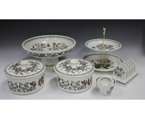 A large collection of Portmeirion Botanic Garden pattern tablewares, including a footed bowl, a wall clock, a two-tier cake s