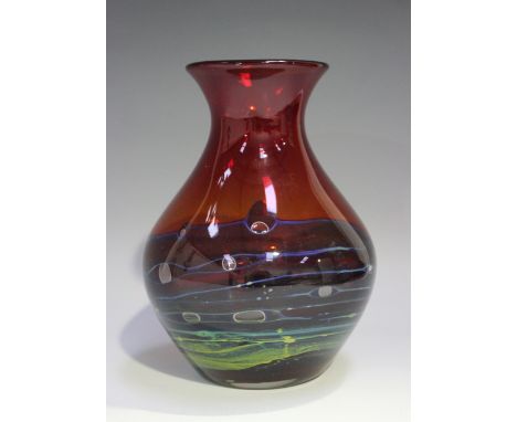 A Whitefriars studio range glass vase, 1970s, designed by Geoffrey Baxter, the ruby body with blue spiral detailing, pattern 