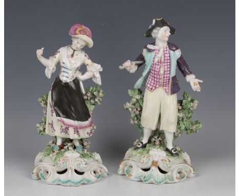 A pair of Derby porcelain figures of a sailor and his lass, circa 1760, the sailor modelled holding a stick and gold coins in