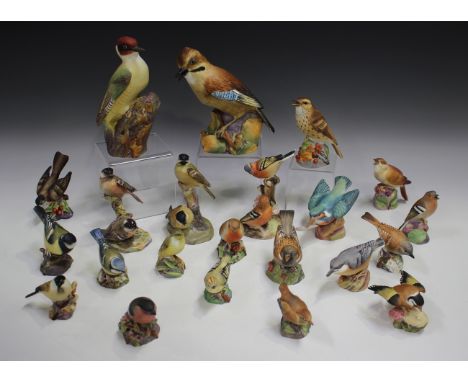 Two Royal Worcester bone china models of birds, comprising Jay, No. 3248, and Woodpecker, No. 3249, three Royal Worcester bir