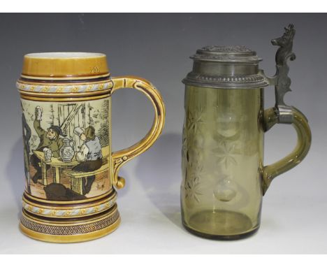 A Mettlach stoneware stein, circa 1885, decorated with a tavern scene, by Warth, impressed marks to base, height 17cm, togeth