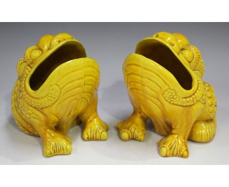 A pair of Wardle pottery spoon warmers, late 19th century, each in the form of a grotesque frog covered in a yellow glaze, im